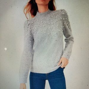 Pearlized puff-sleeve cable sweater